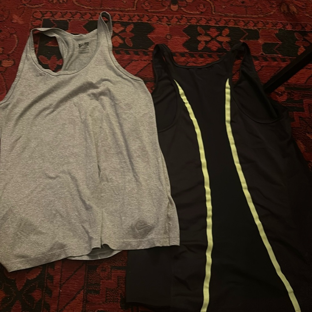 Pair of Nike dry fit athletic razor back tanks
